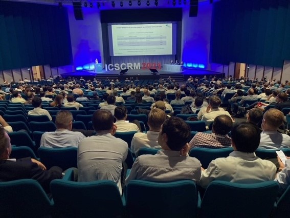 Full conference hall at ICSCRM 2023, seen from the back rows